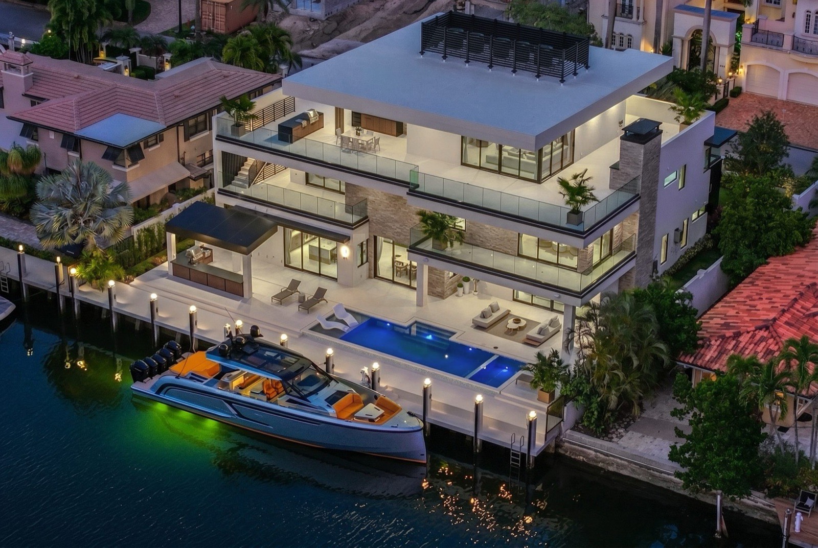 Aerial view of the residence, rooftop terrace, pool, and dock